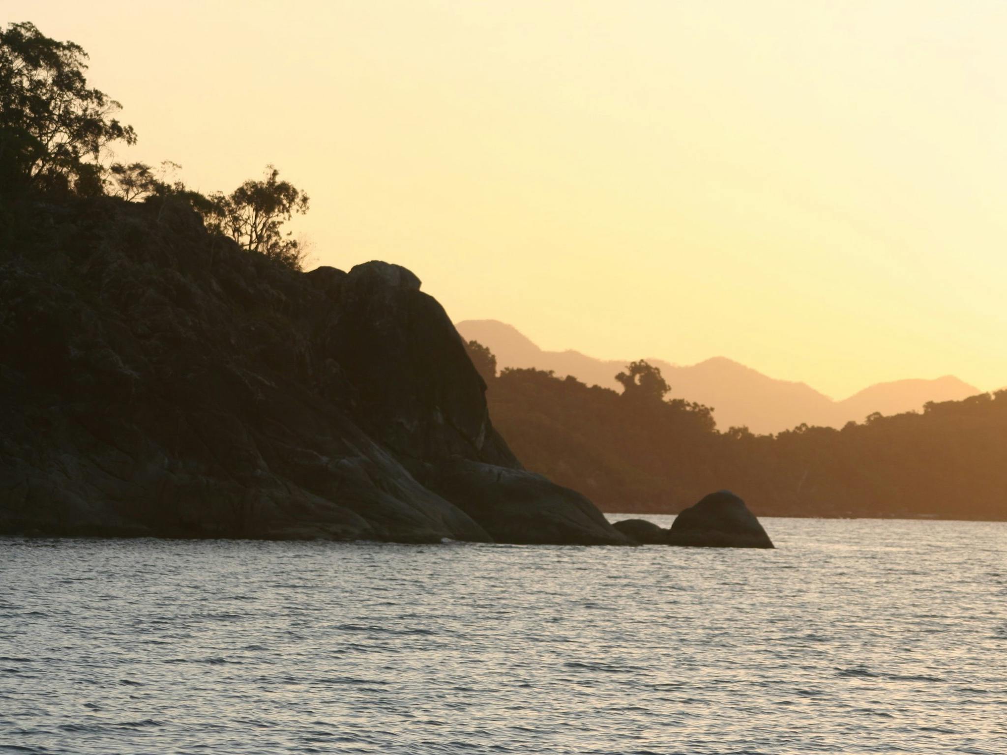 Hinchinbrook Island's coastline at sunset