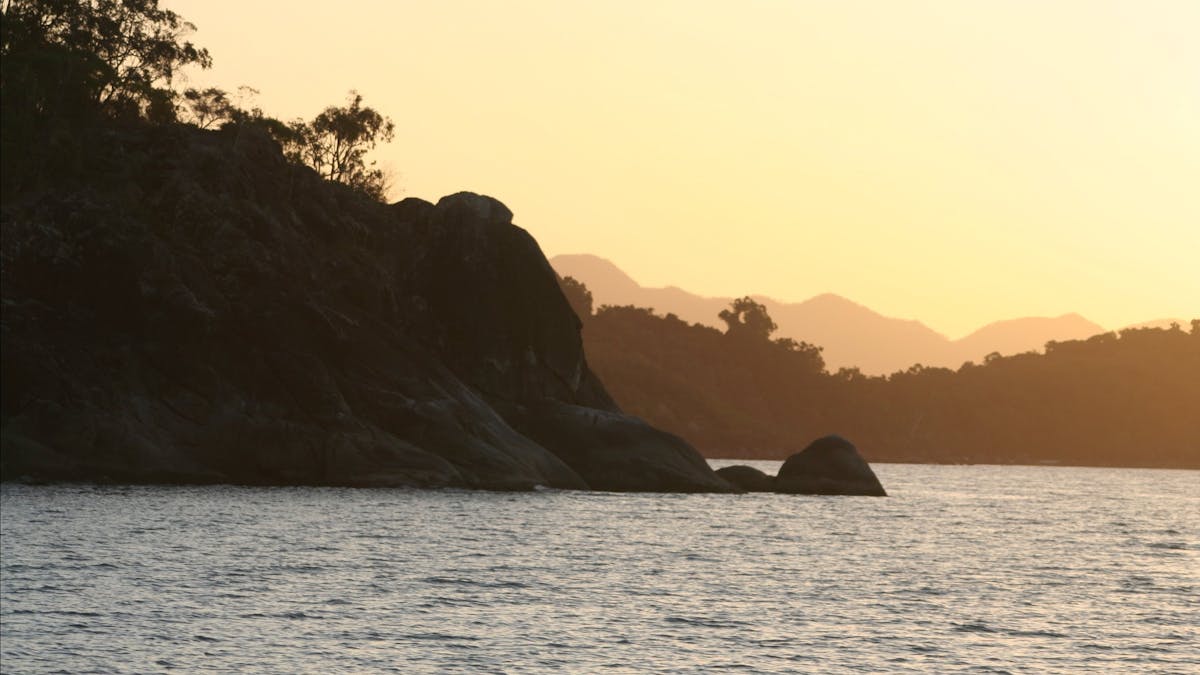 Hinchinbrook Island's coastline at sunset