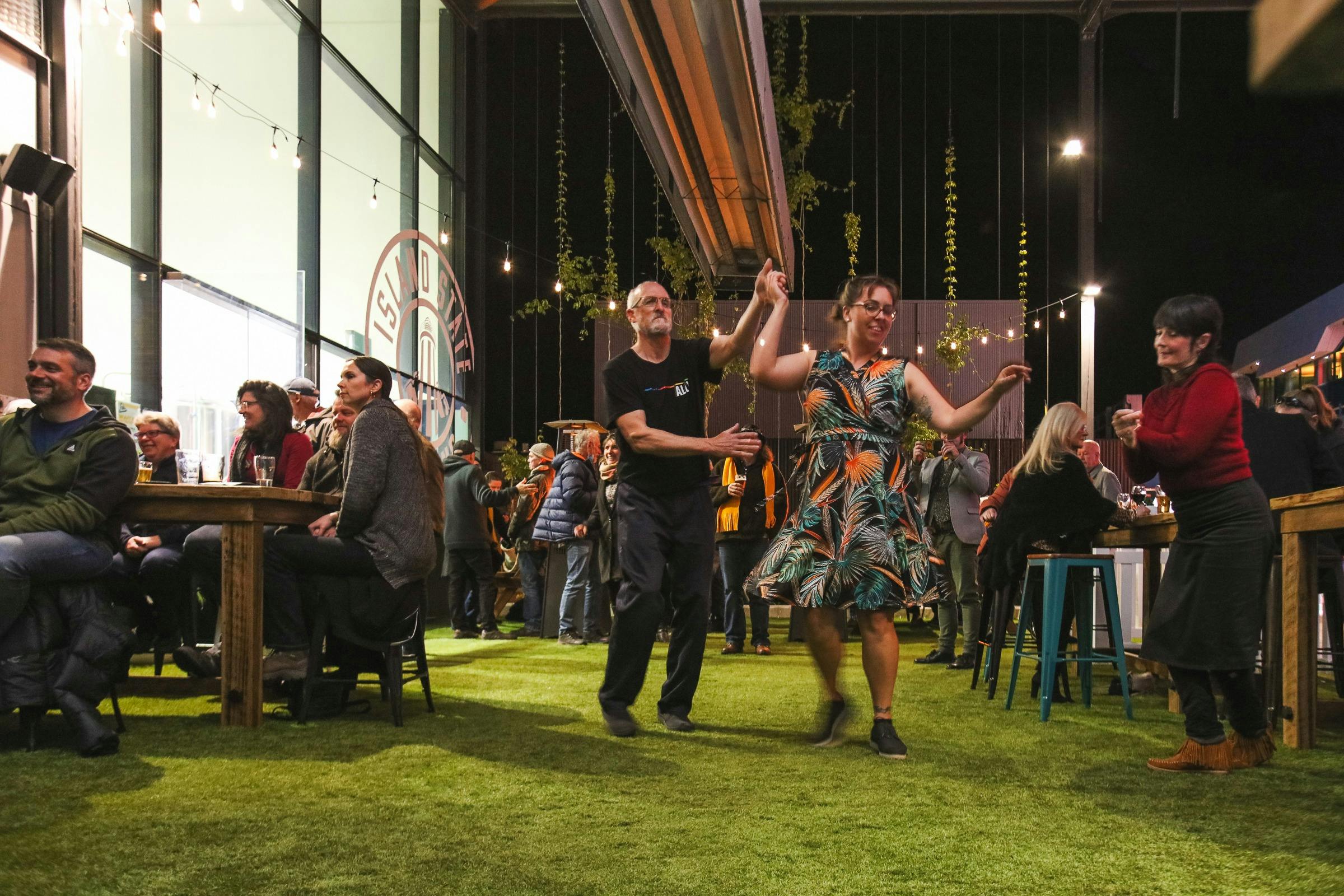couple dancing at outdoor venue