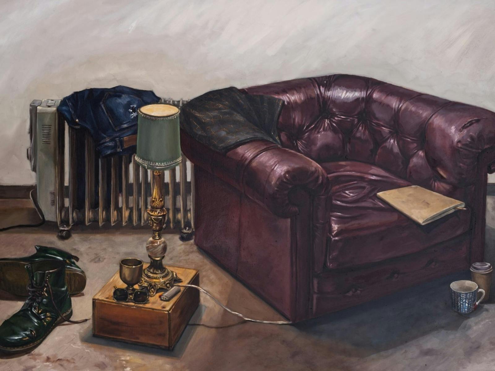 A painting of a chesterfield arm chair with a lamp, boots and cups arranged around it