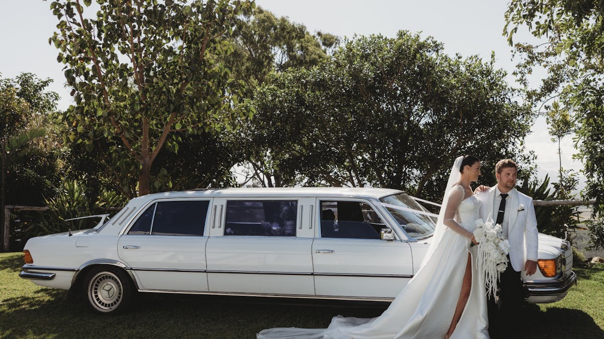 Classic 1978 Mercedes-Benz white Bridal Stretch with Bride & Groom