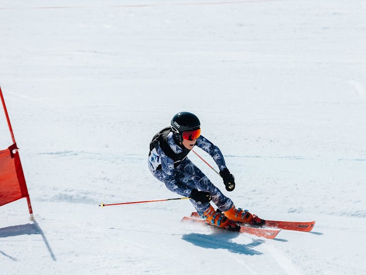 skiier going past a flag
