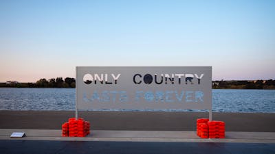 A metal sign that reads