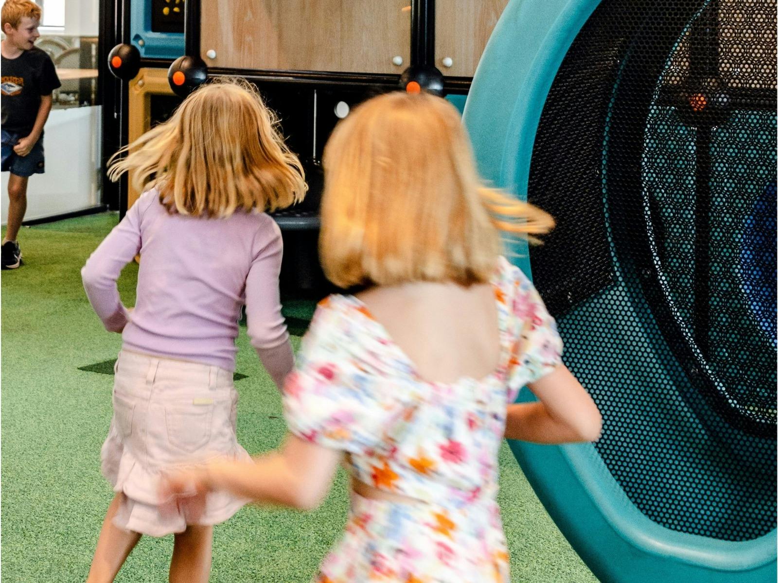 children running through playground