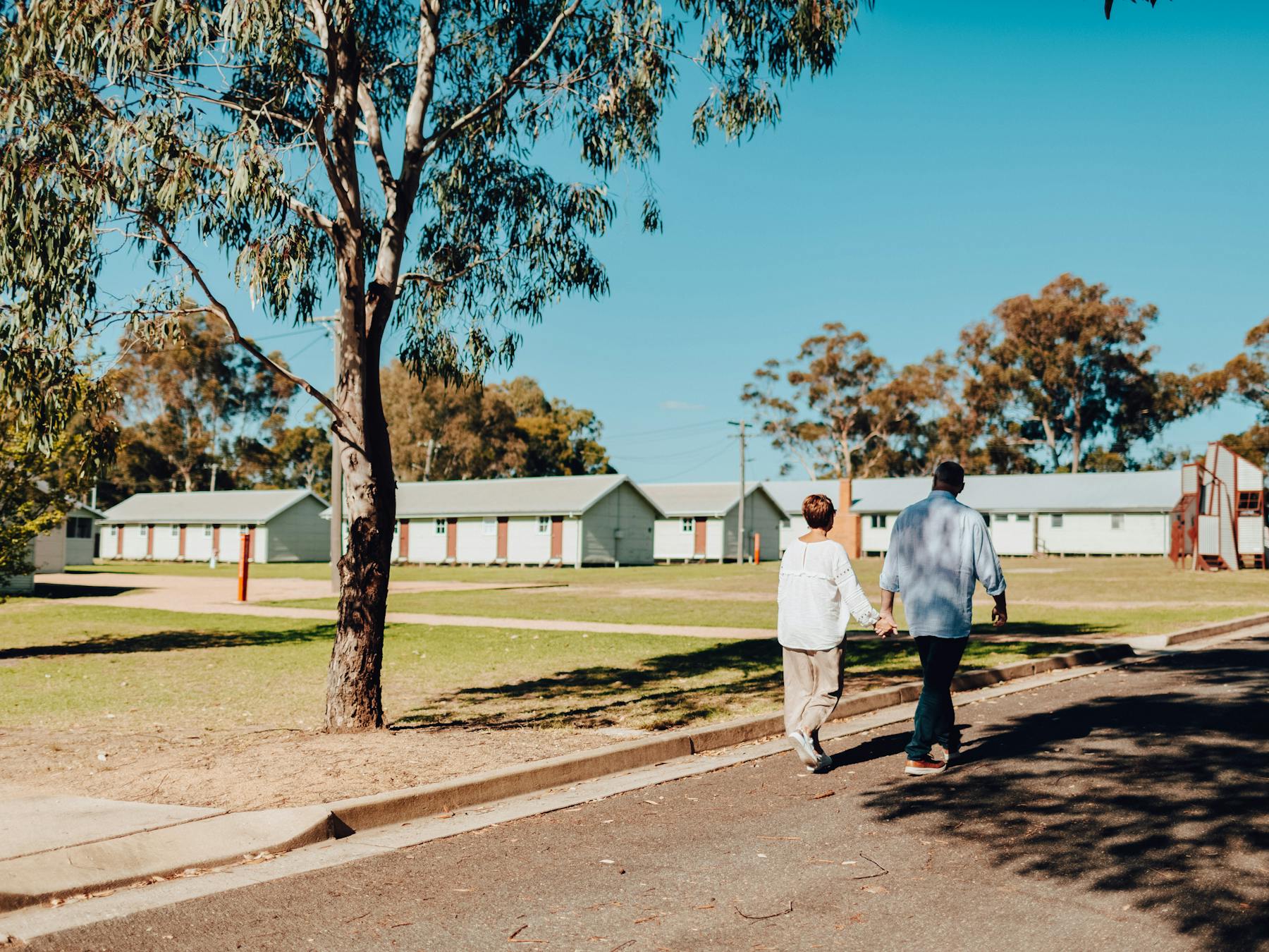 two people walking at the Bonegilla Migrant Experience