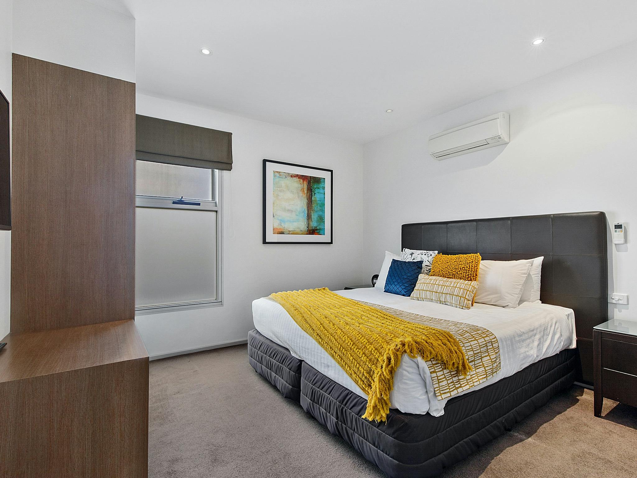 Main Bedroom with wardrobe, LCD television and luxury bedding at The Gateway