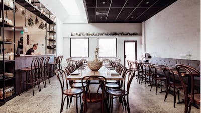 Empty restaurant with tables set ready for service