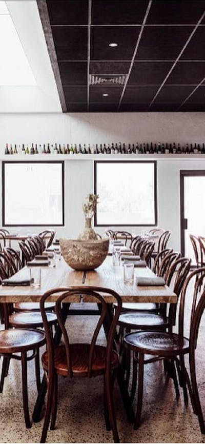 Empty restaurant with tables set ready for service