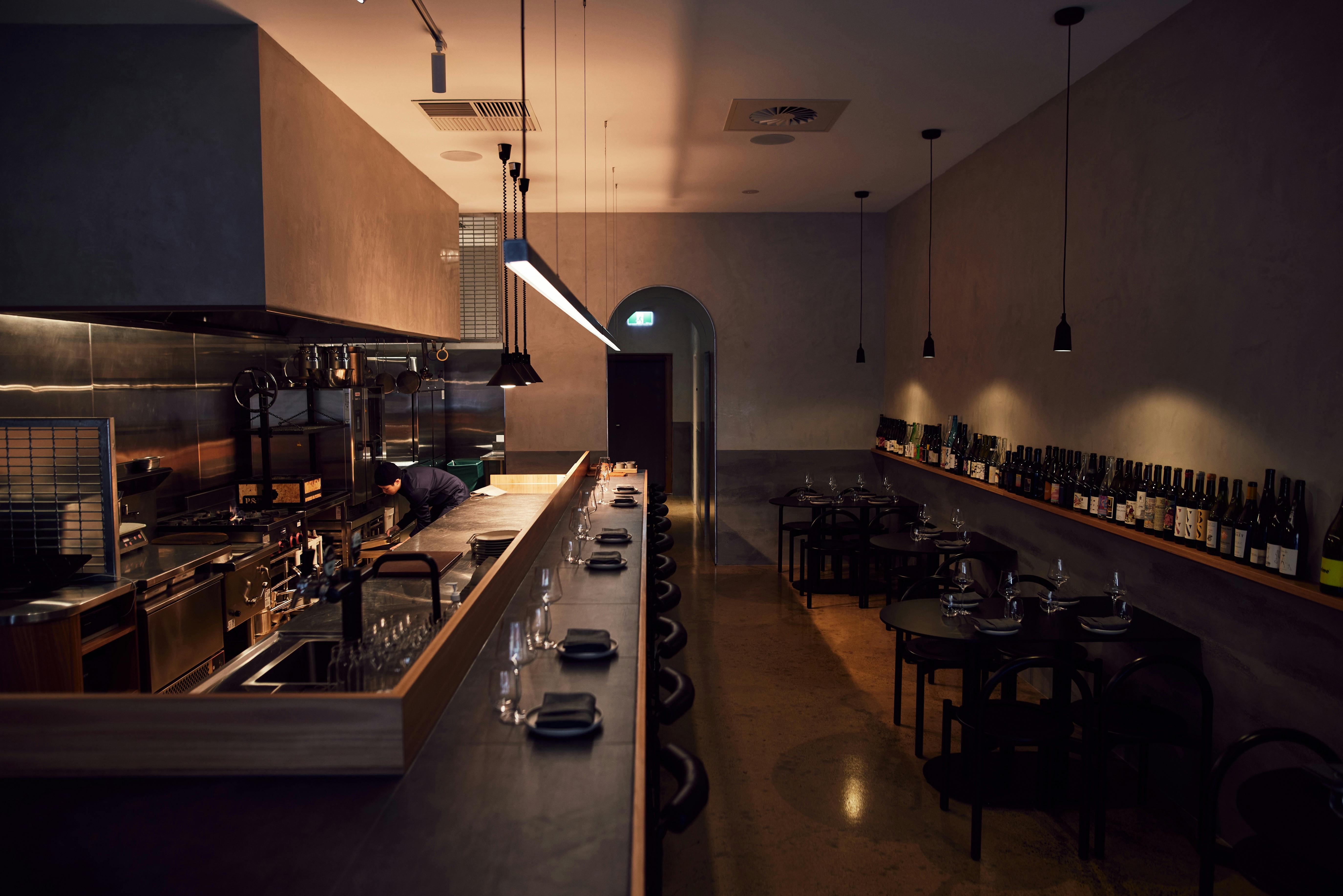 Interior view of Muni, a long counter seating with open kitchen
