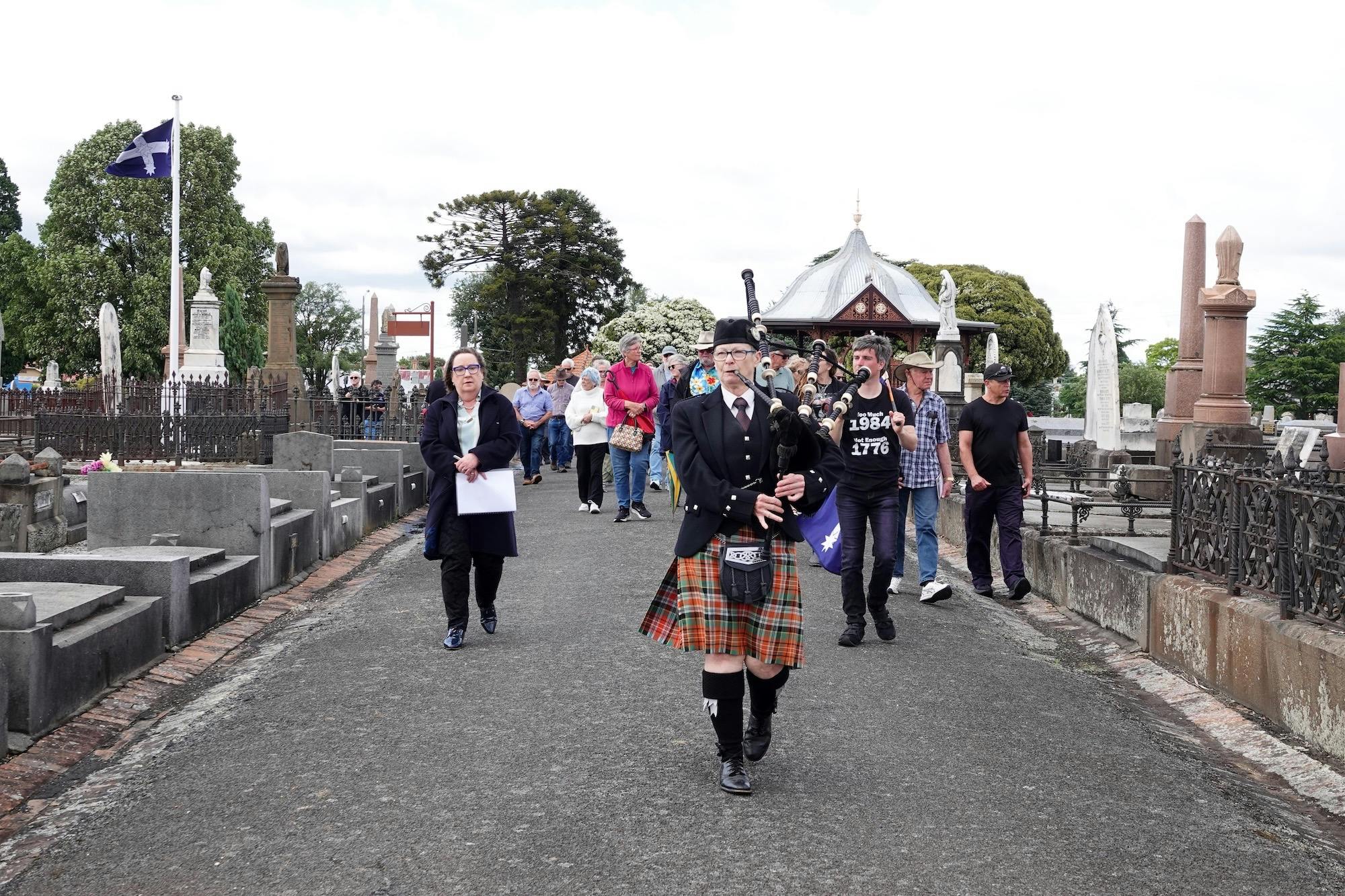 Ballarat Old Cemetery Eureka procession led by bagpipe player Sue Brant