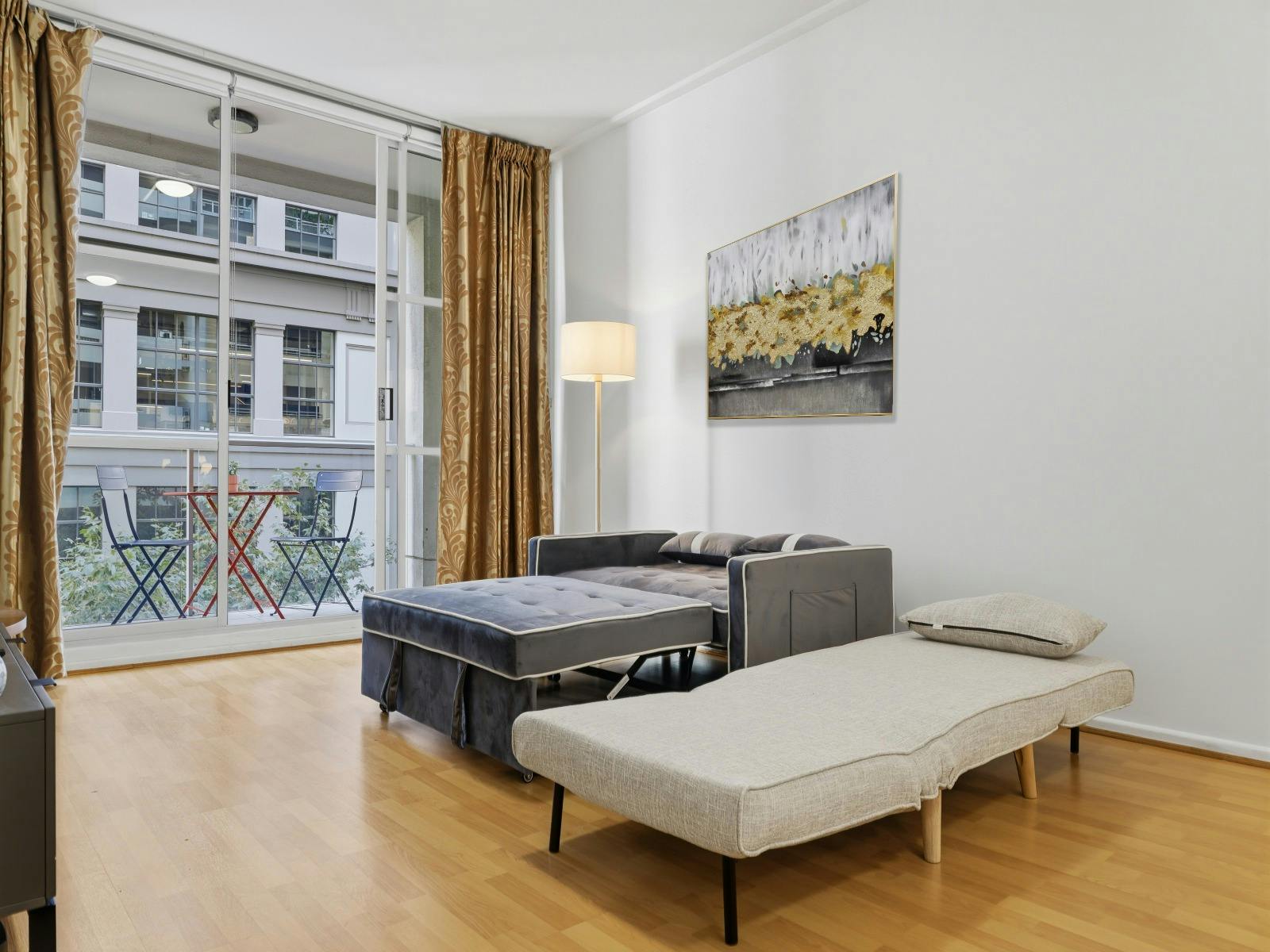 Open living space with sofa and bed