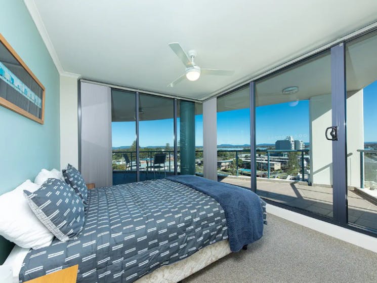 Bedroom with views and ceiling fan