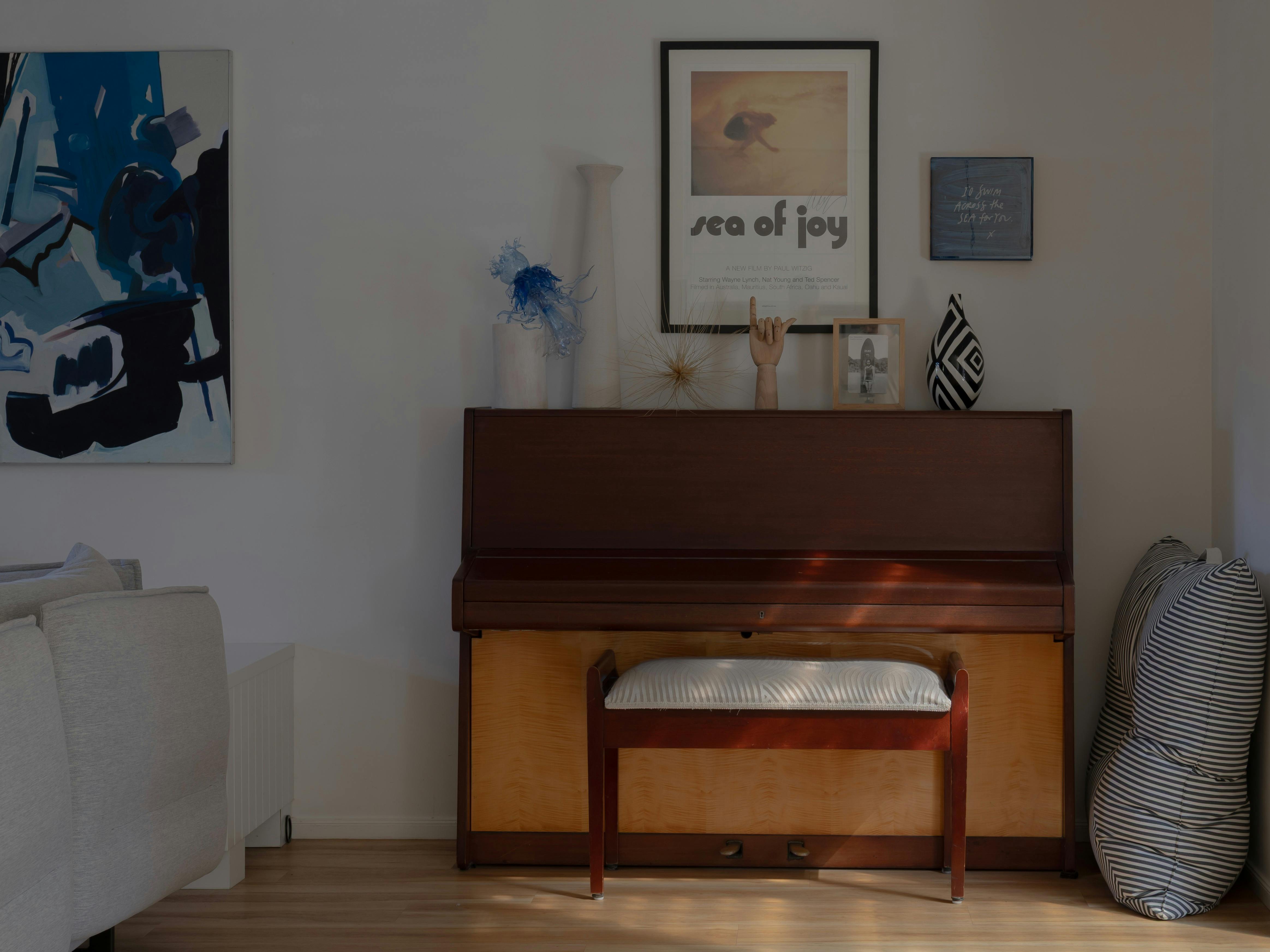 Colourful Piano vignette with surf art sculptures