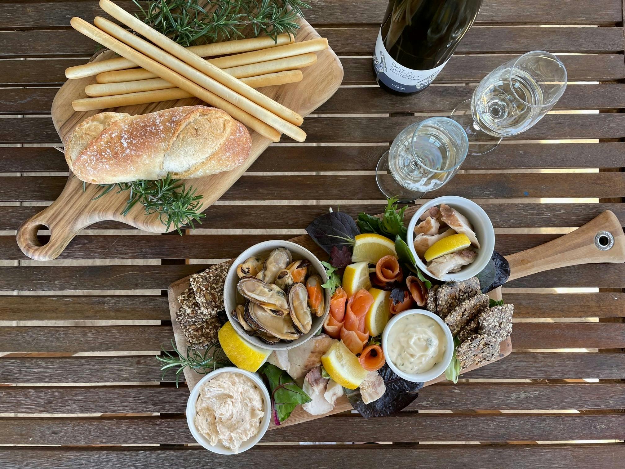 Rustic seafood platter and wine.