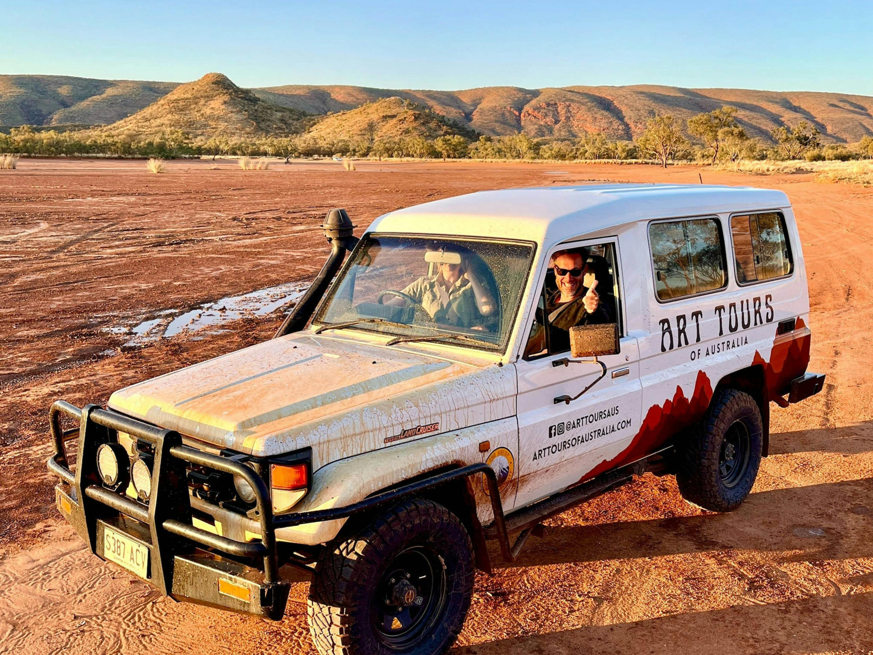 Art Tours of Australia Troopie covered in mud on a claypan.