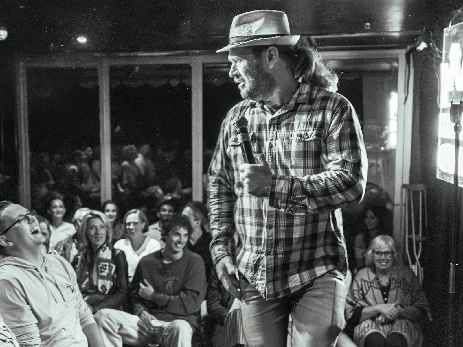 Comedian standing in front of crowd
