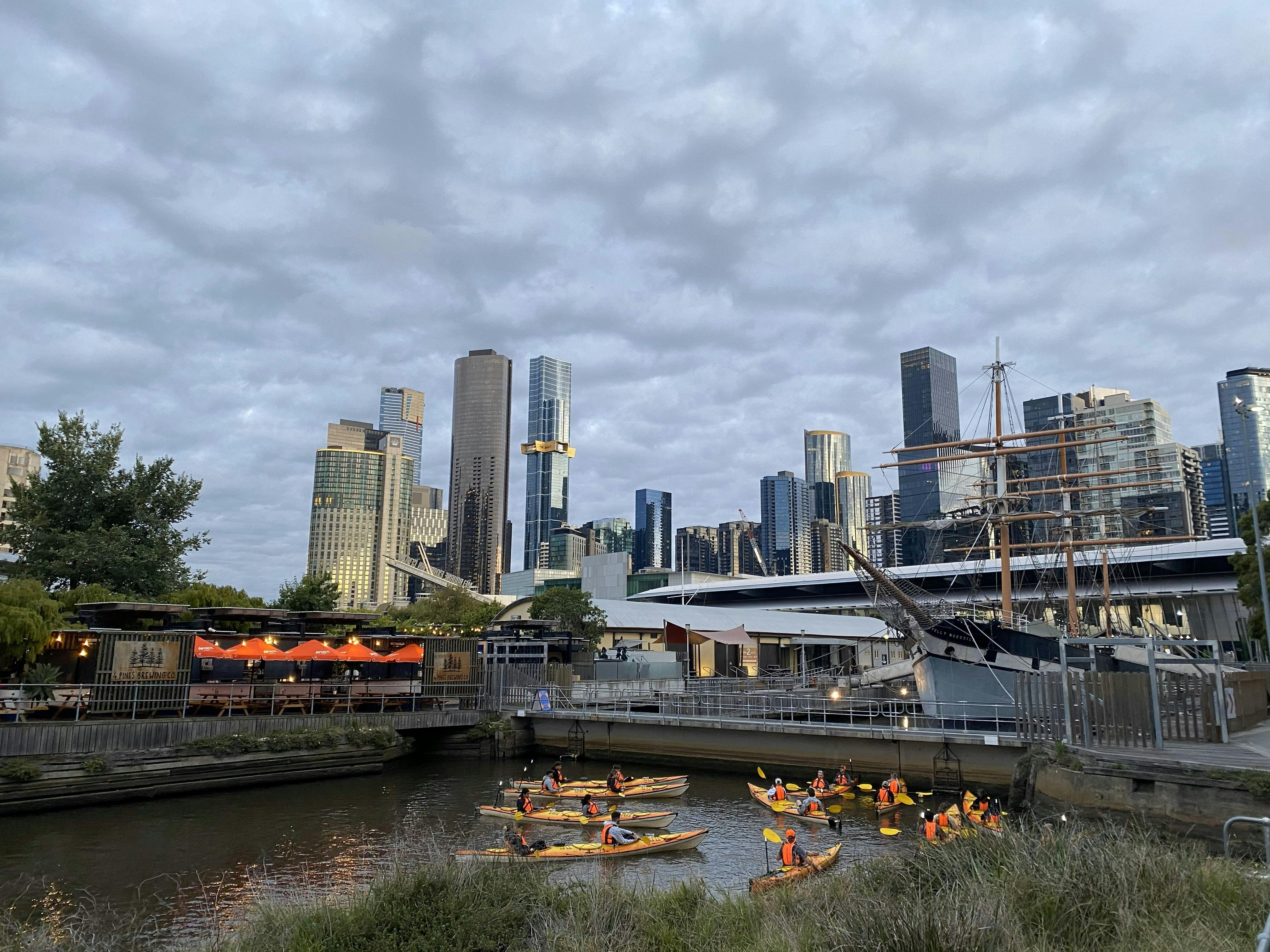 Kayak group in foreground with Polly Woodside Tall Ship in the background.
