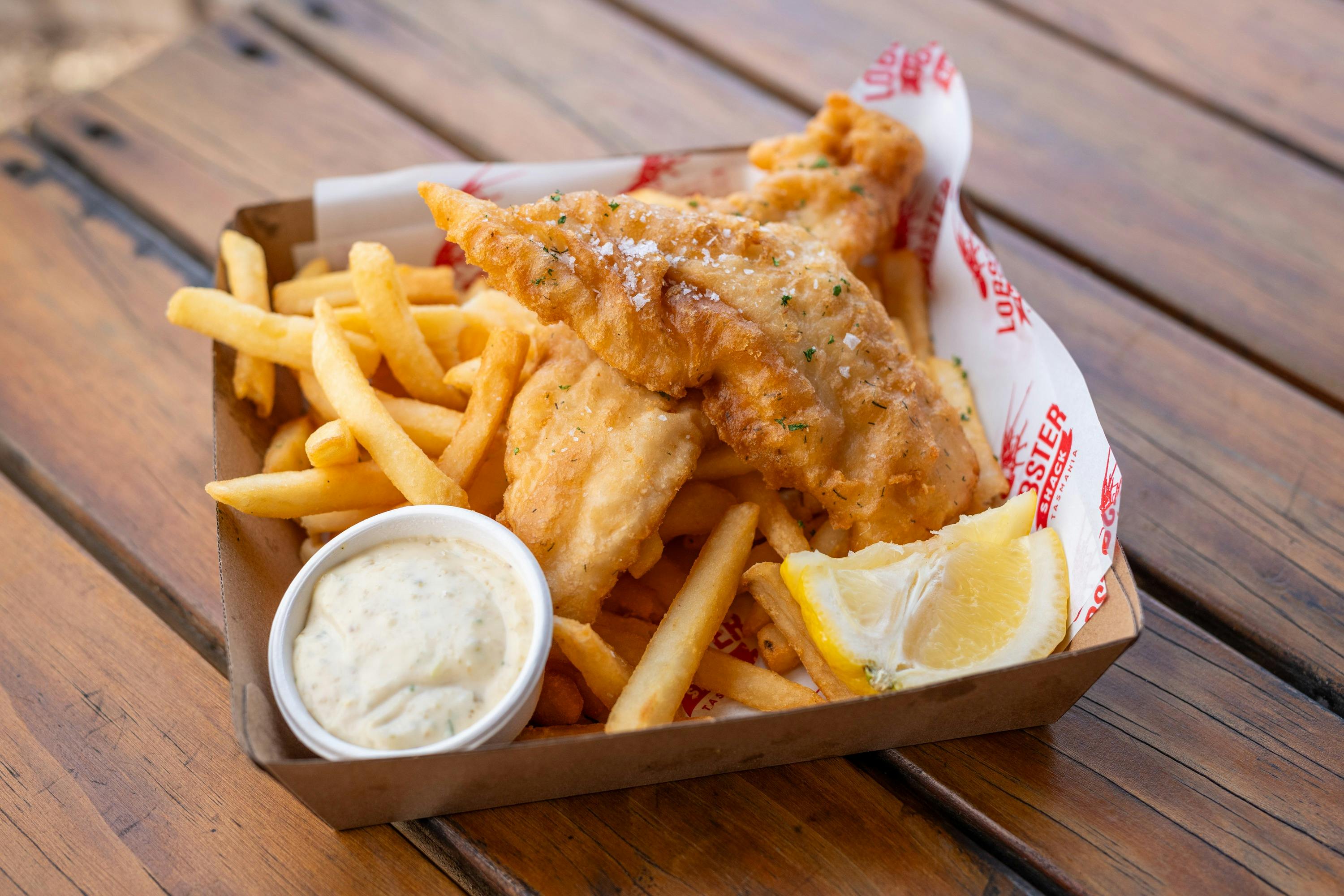 Photo of a serve of gish and chips with tartare sauce and lemon