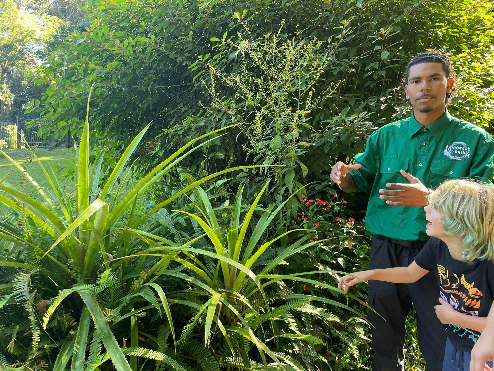 Guide explaining traditional plant use at Lake Barrine