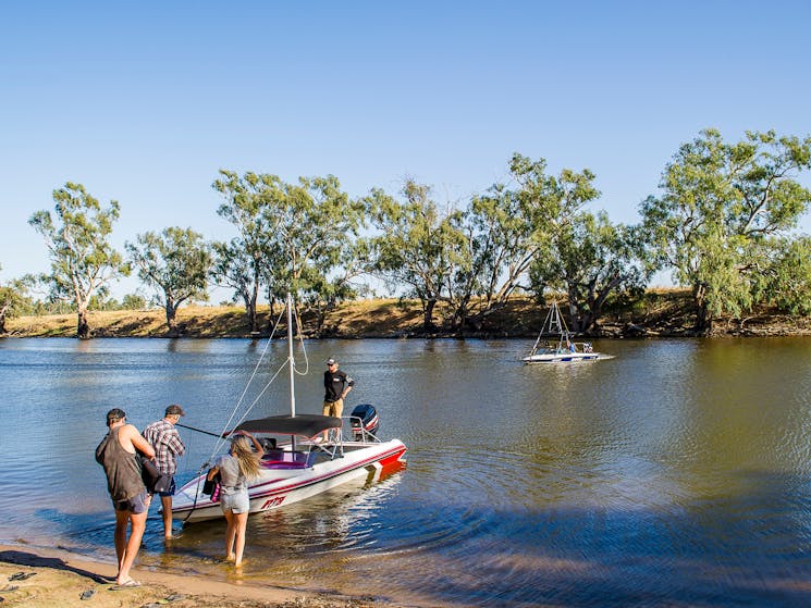 Boat on shore at ski dam