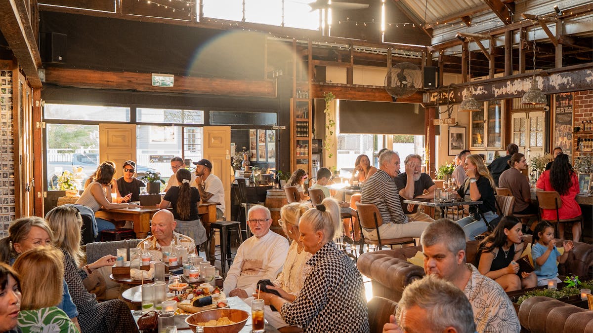 Crowd enjoying drinks inside Granddad Jack’s Craft Distillery.