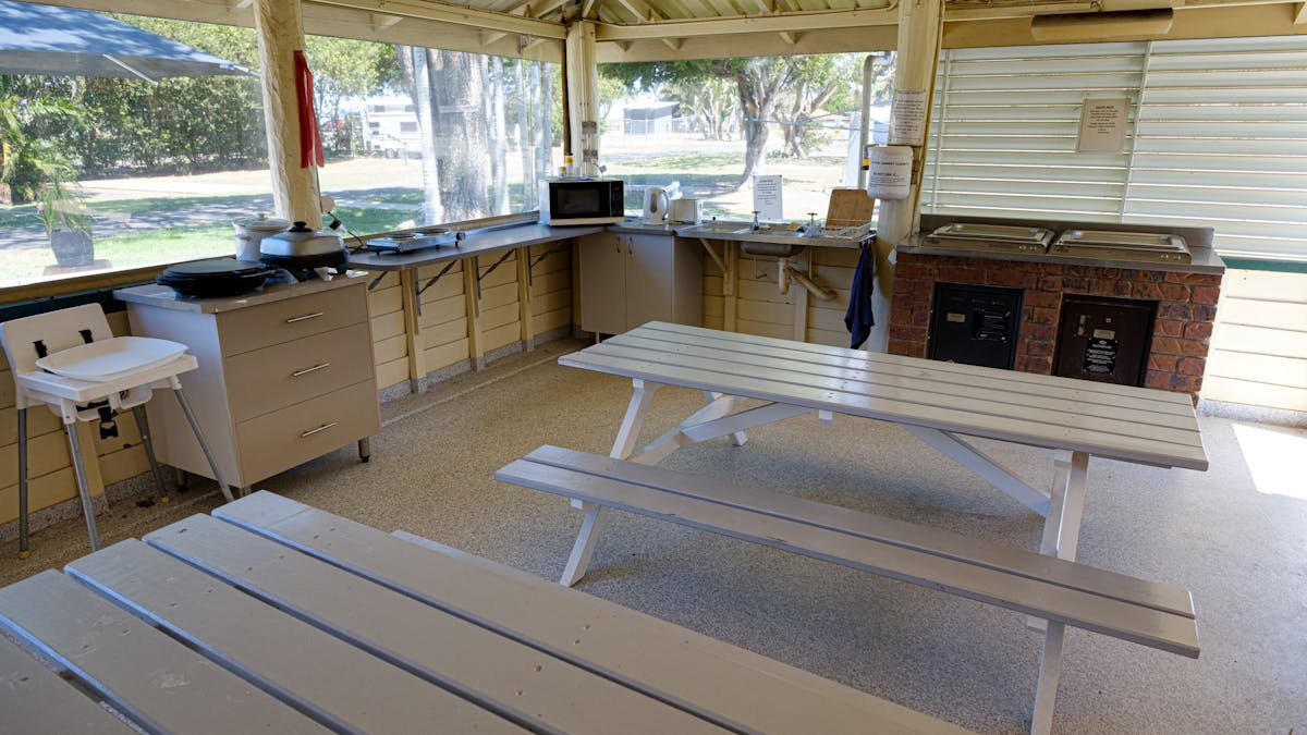 Camp kitchen with BBQ, microwave and cafe blinds.
