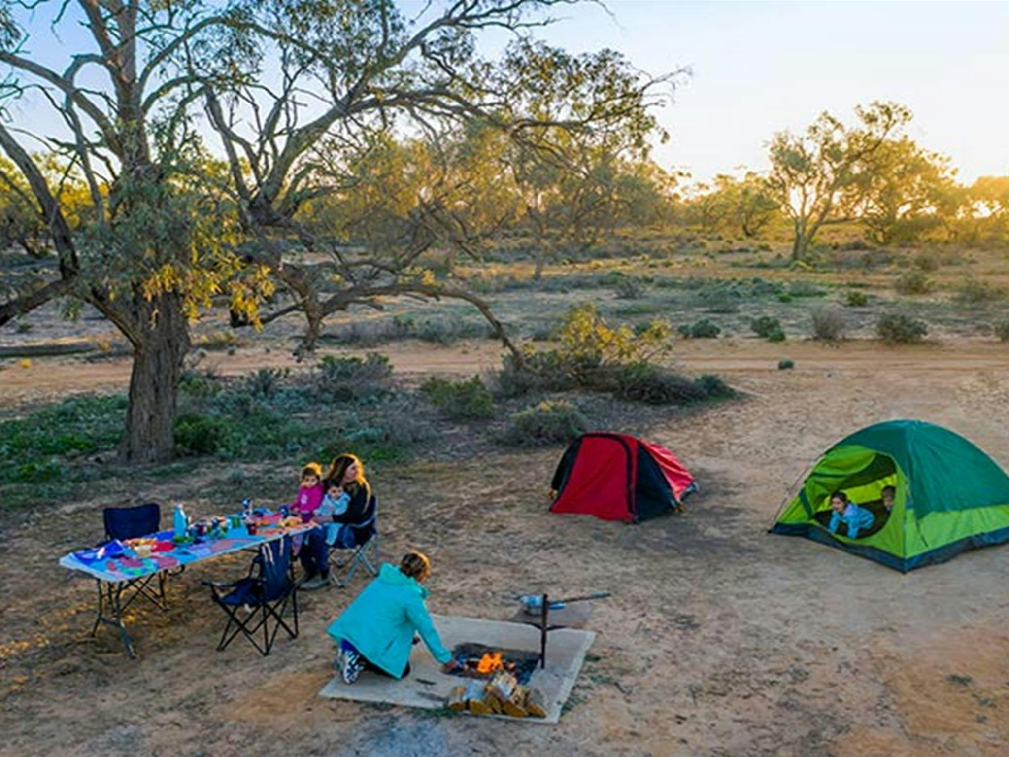Family with young kids camping at Emu Lake campground in Kinchega National Park. Photo: John