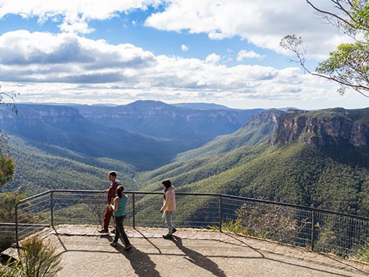 Visitors take in the views from Evans lookout, Blue Mountains National Park. Photo: Simone Cottrell