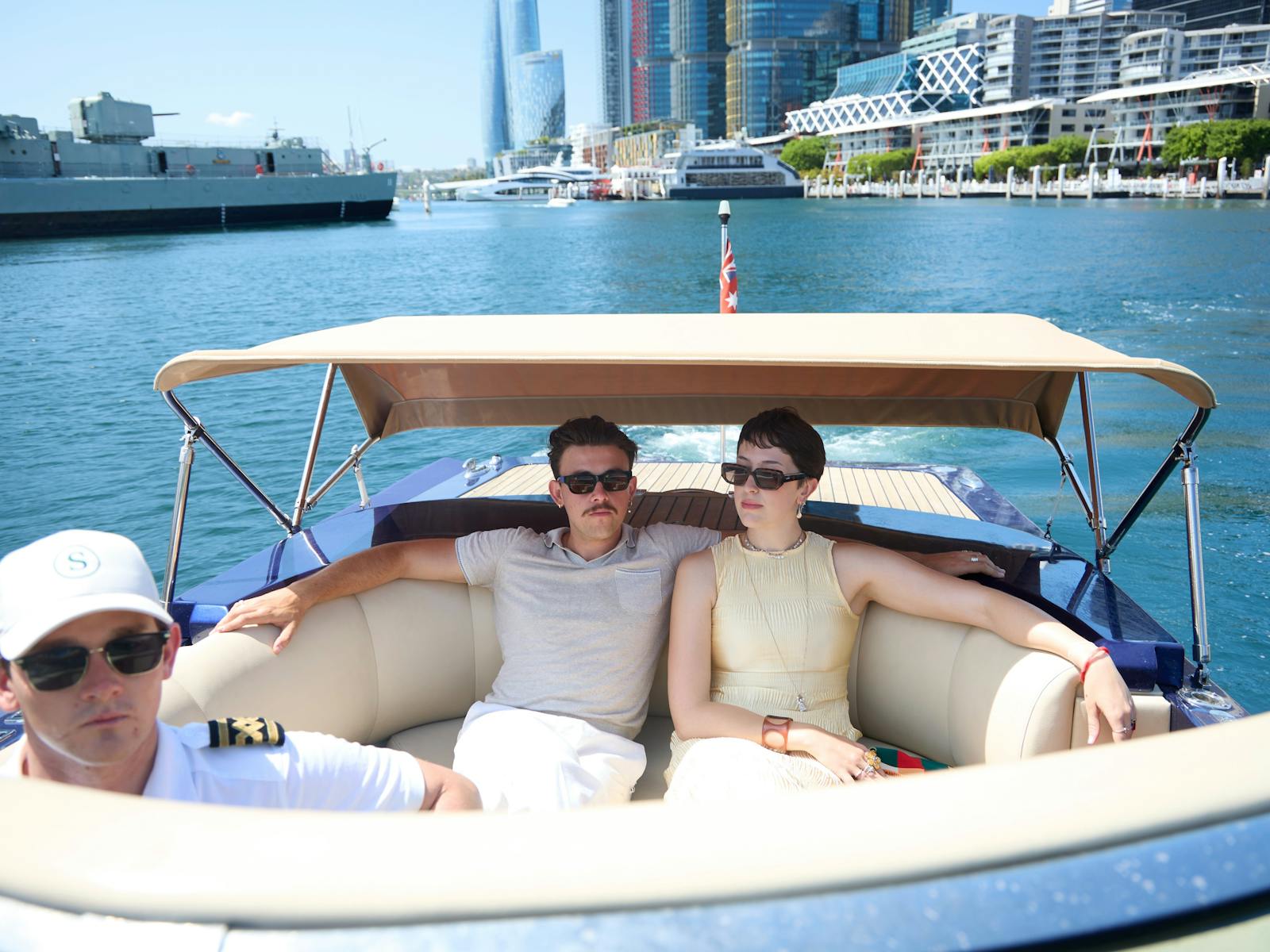 Private boat tour on MV Aquamajestic cruising Sydney Harbour with city skyline views.