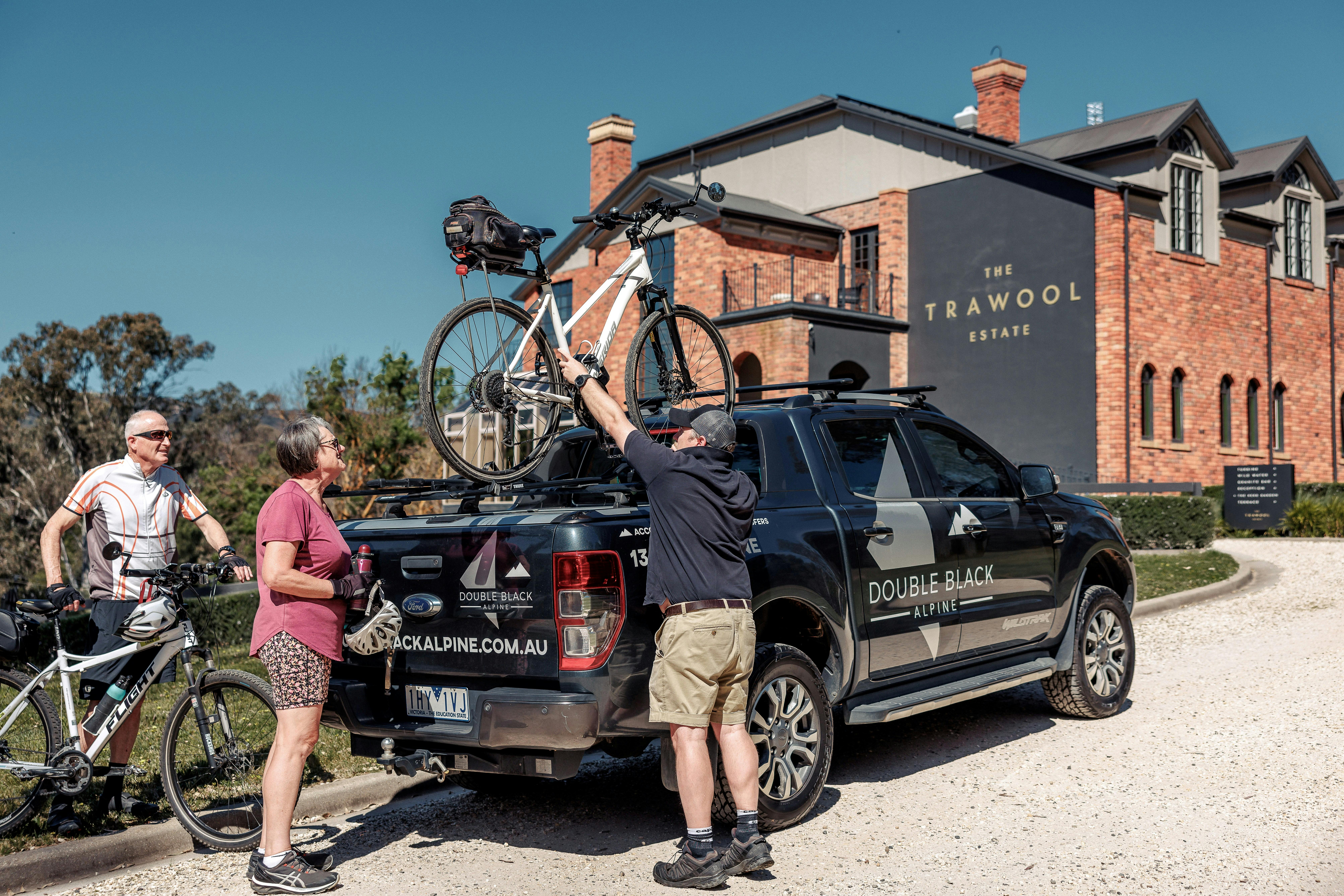 At Trawool Estate, guests watch as their bikes are securely loaded onto Double Black's bike carrier
