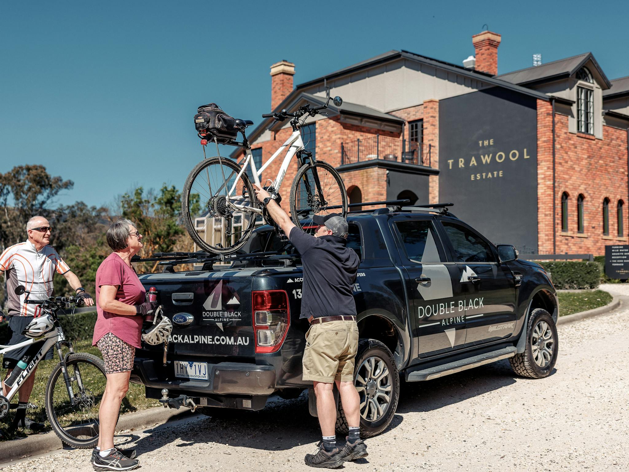 At Trawool Estate, guests watch as their bikes are securely loaded onto Double Black's bike carrier
