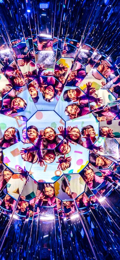 Child enjoying the Illuminate exhibition