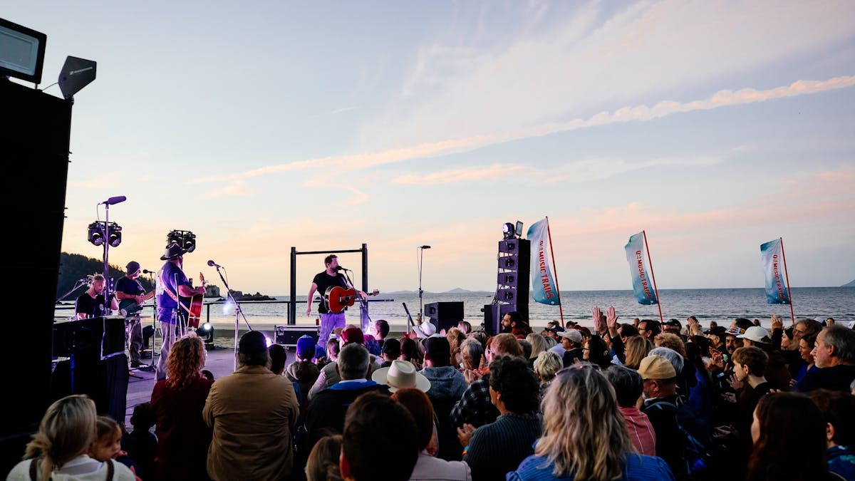 Music festival on the beach at sunset