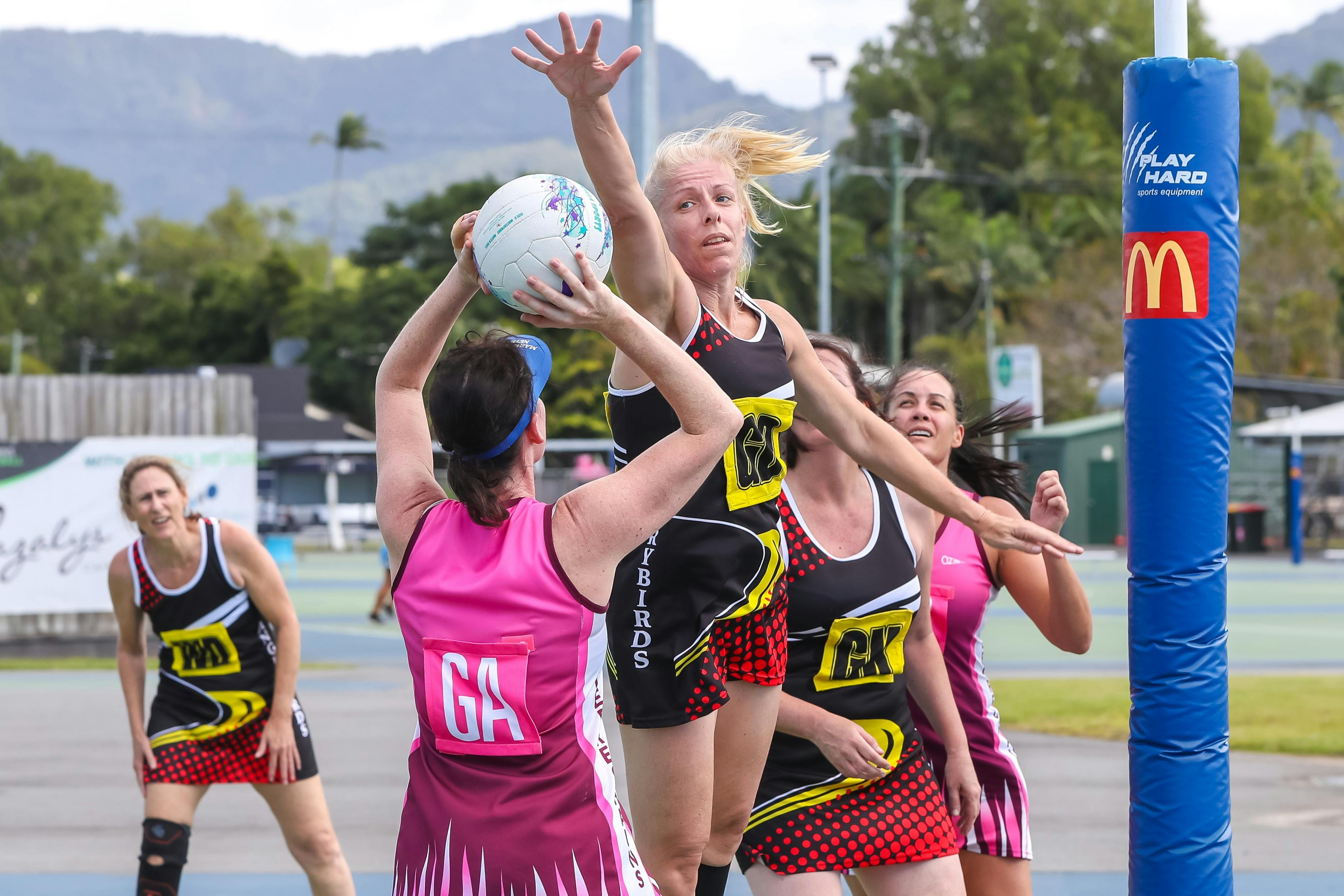 Netball player defending the ball
