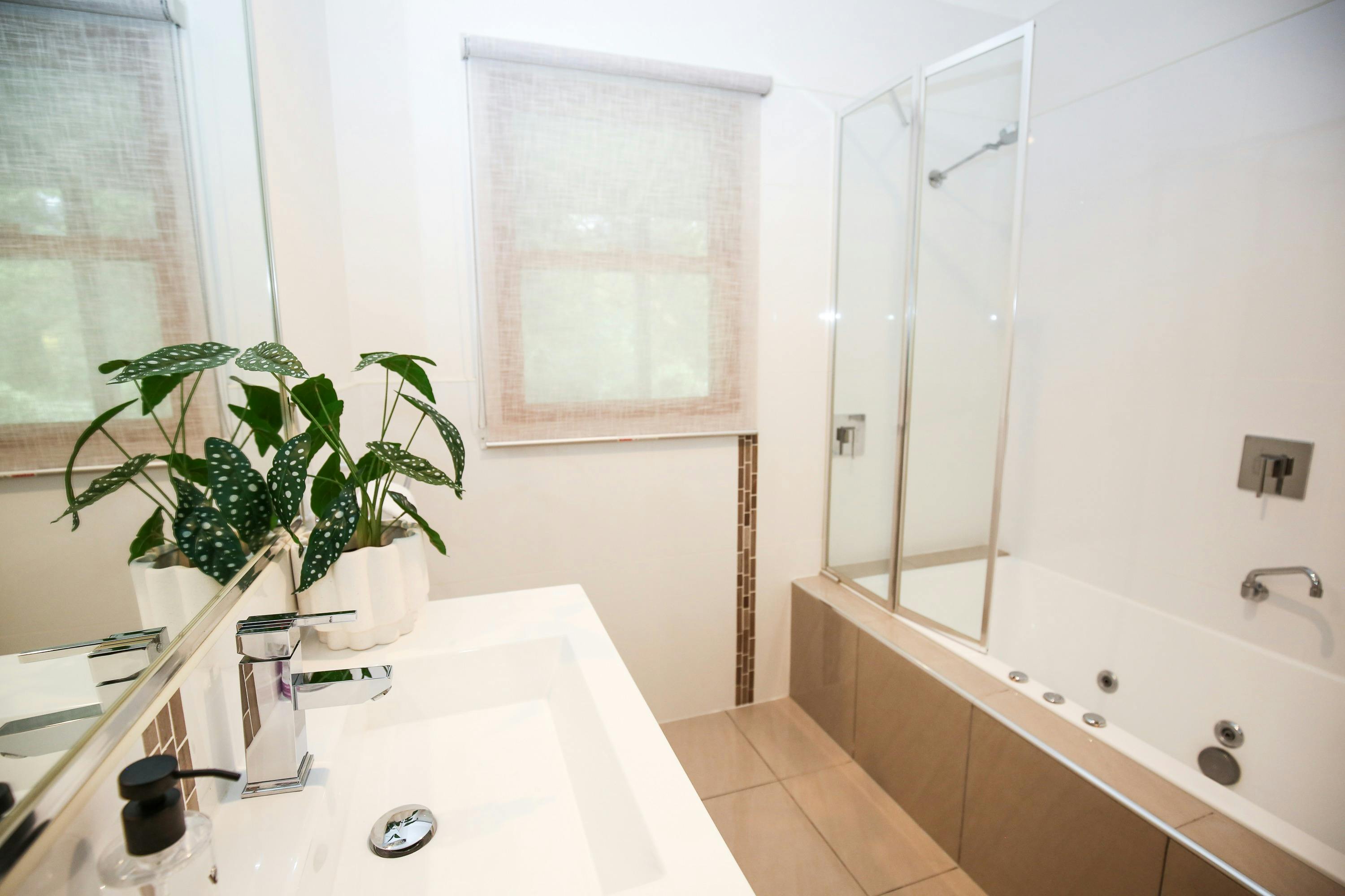 Bathroom with bath and shower