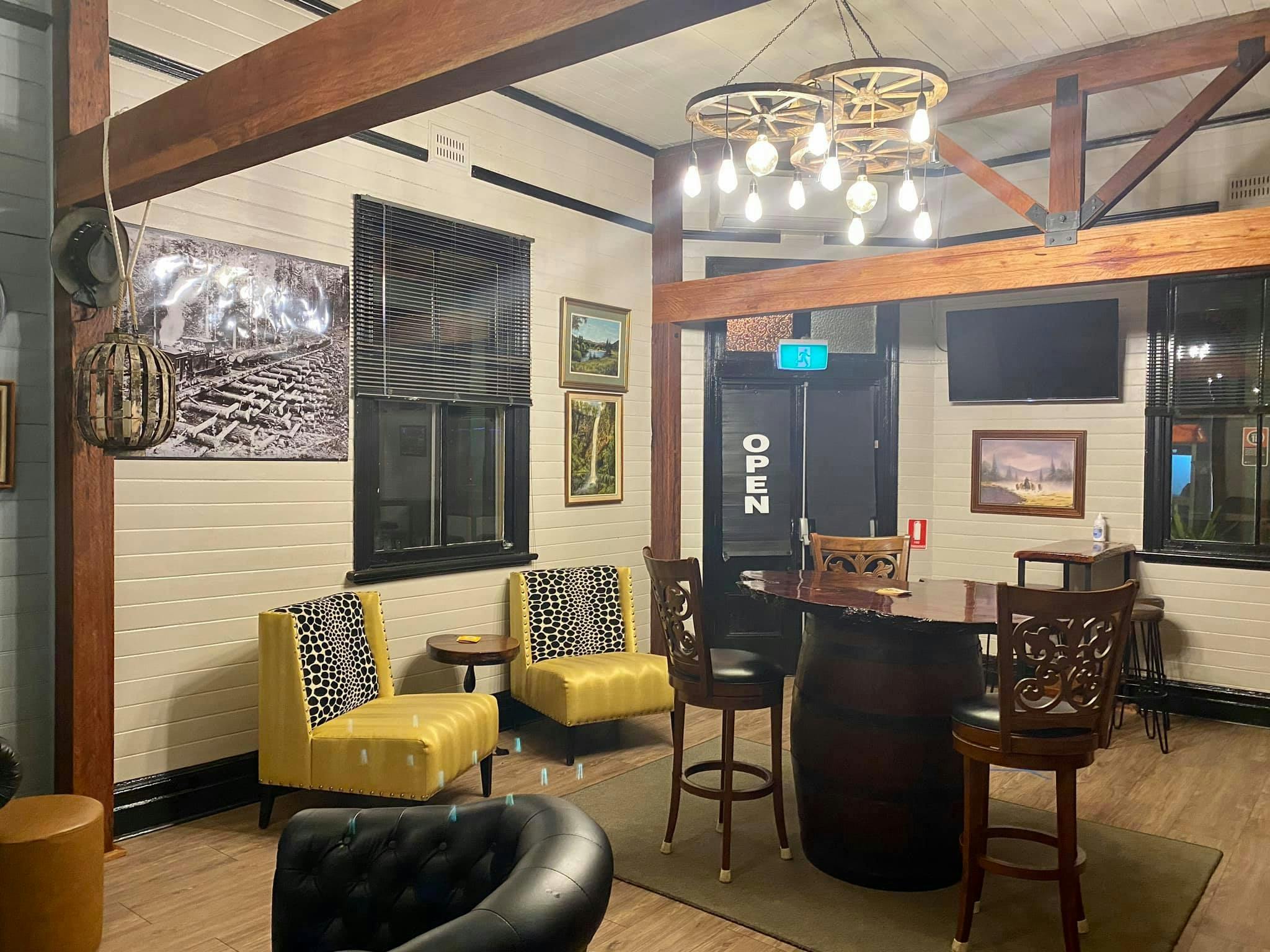 Coffee lounge with yellow chairs and chandeliers