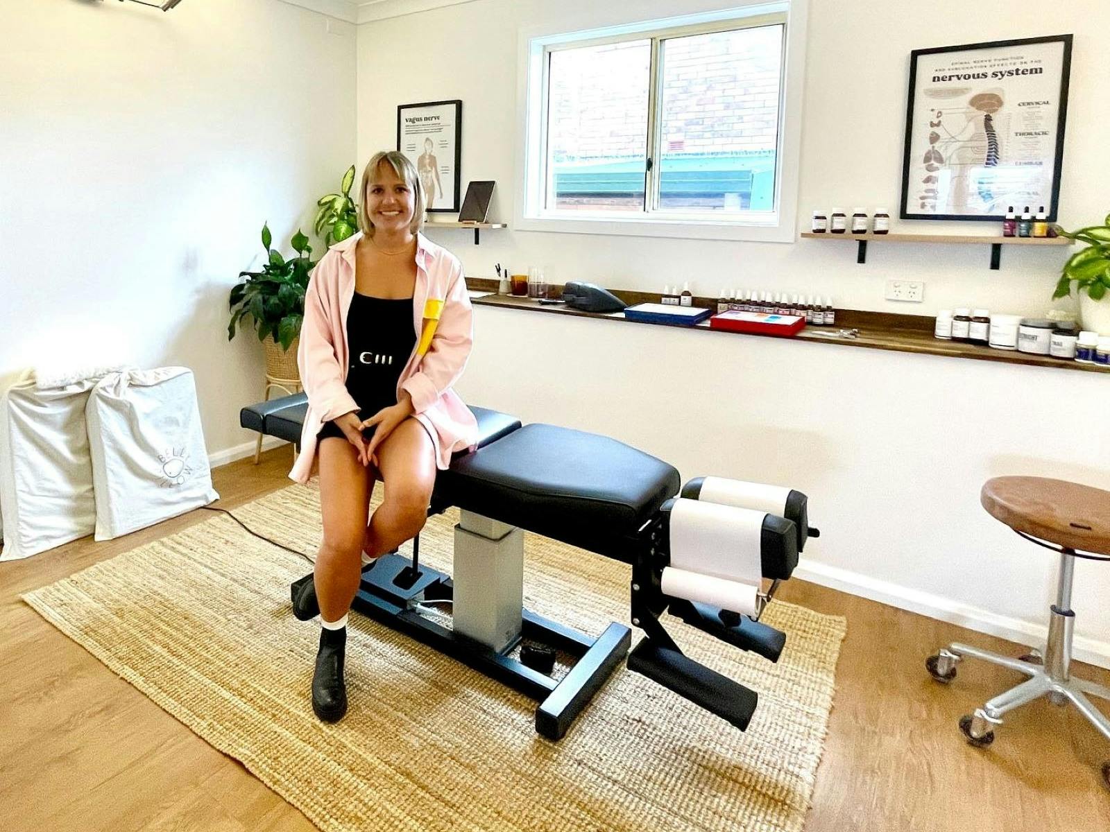 Dr Karli sitting on massage table