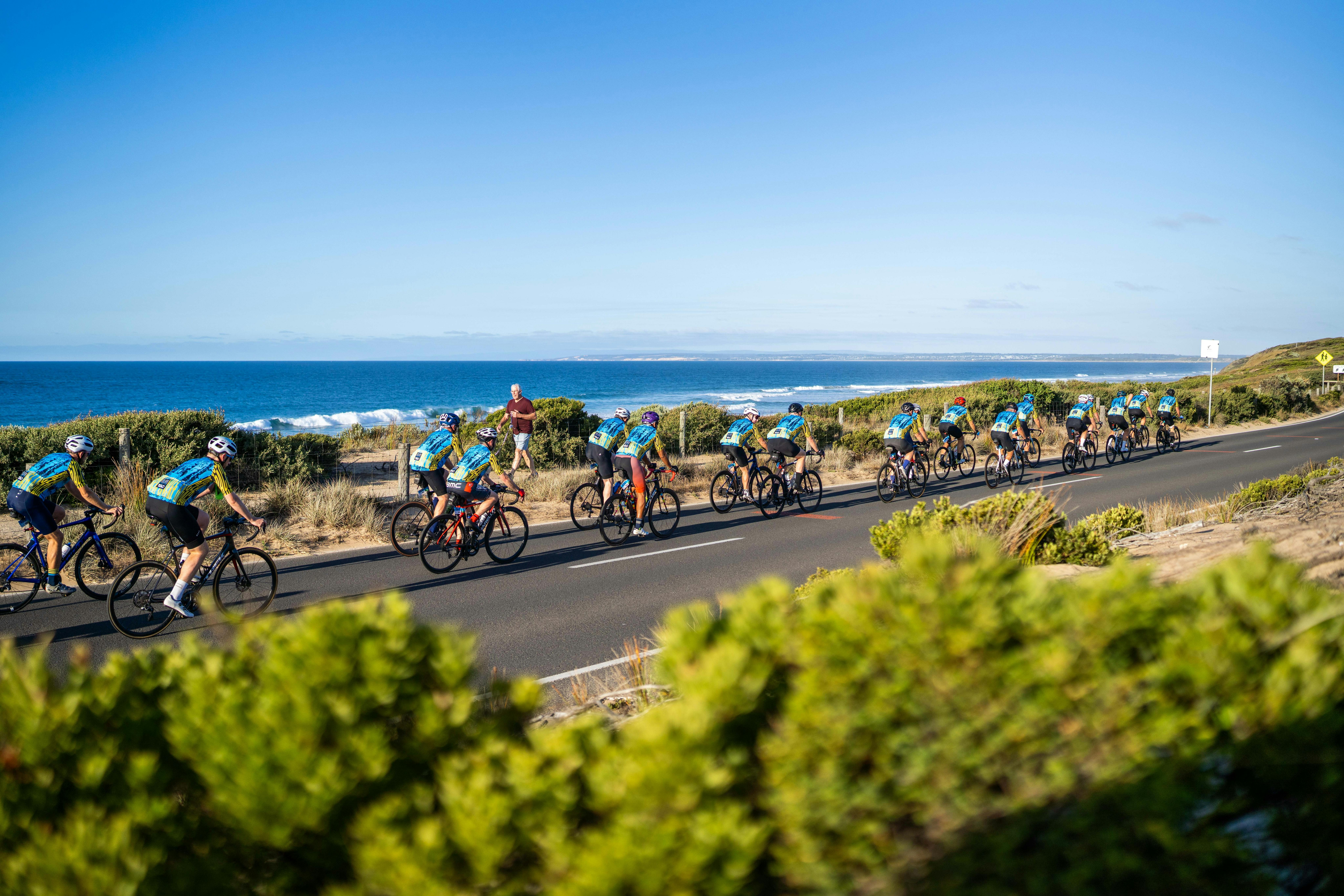 Cyclists cycling along the coast