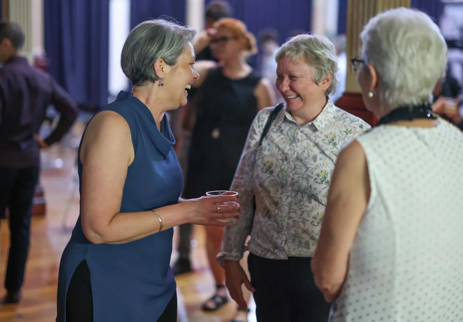 women talking and laughing