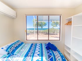 Beachfront Cabin Bedroom, Mackerel Islands, Western Australia