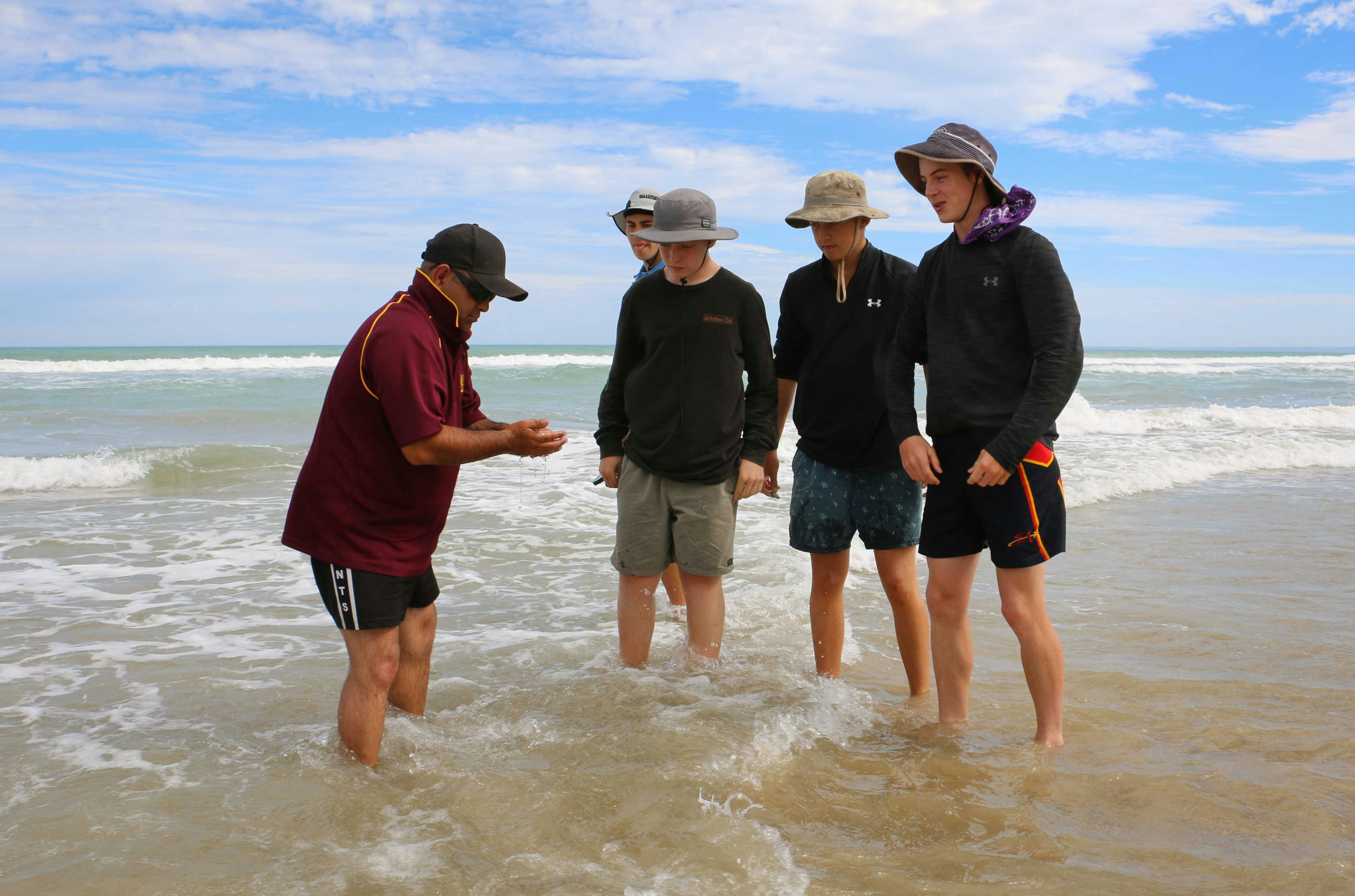 Joe one of our highly experienced tour operators showing how to  collect food.
