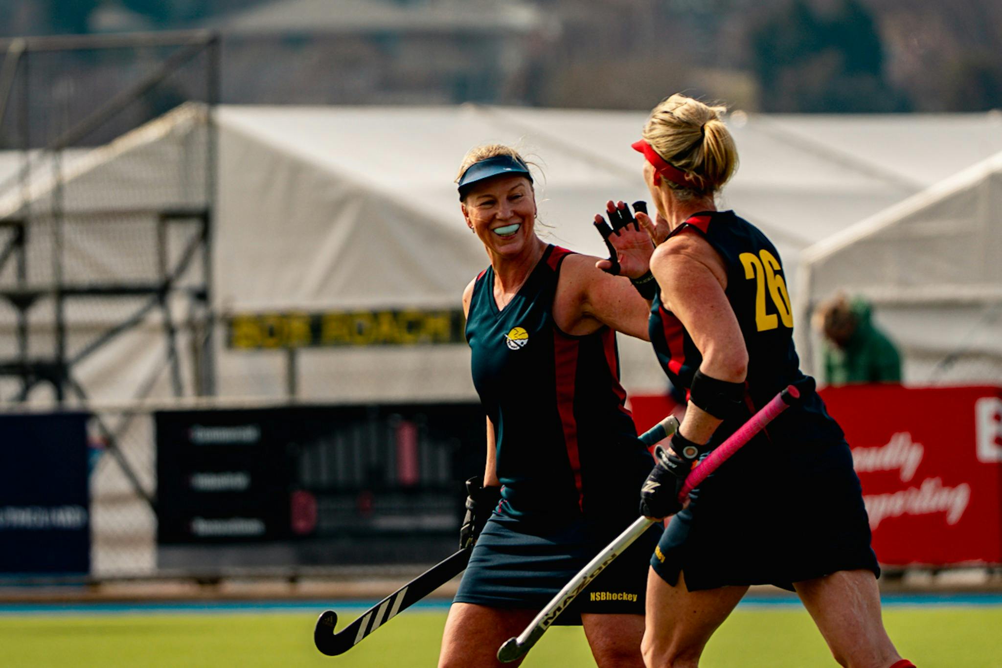 Women's Masters Hockey Players Celebrate a Goal