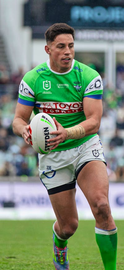 Canberra Raiders player Joseph Tapine running the ball.