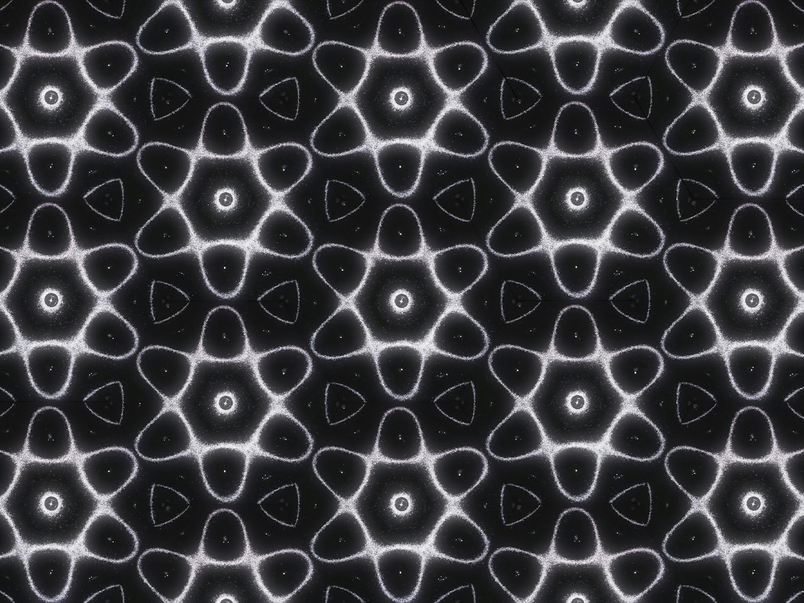 Repeating white geometric patterns glowing against a black background.