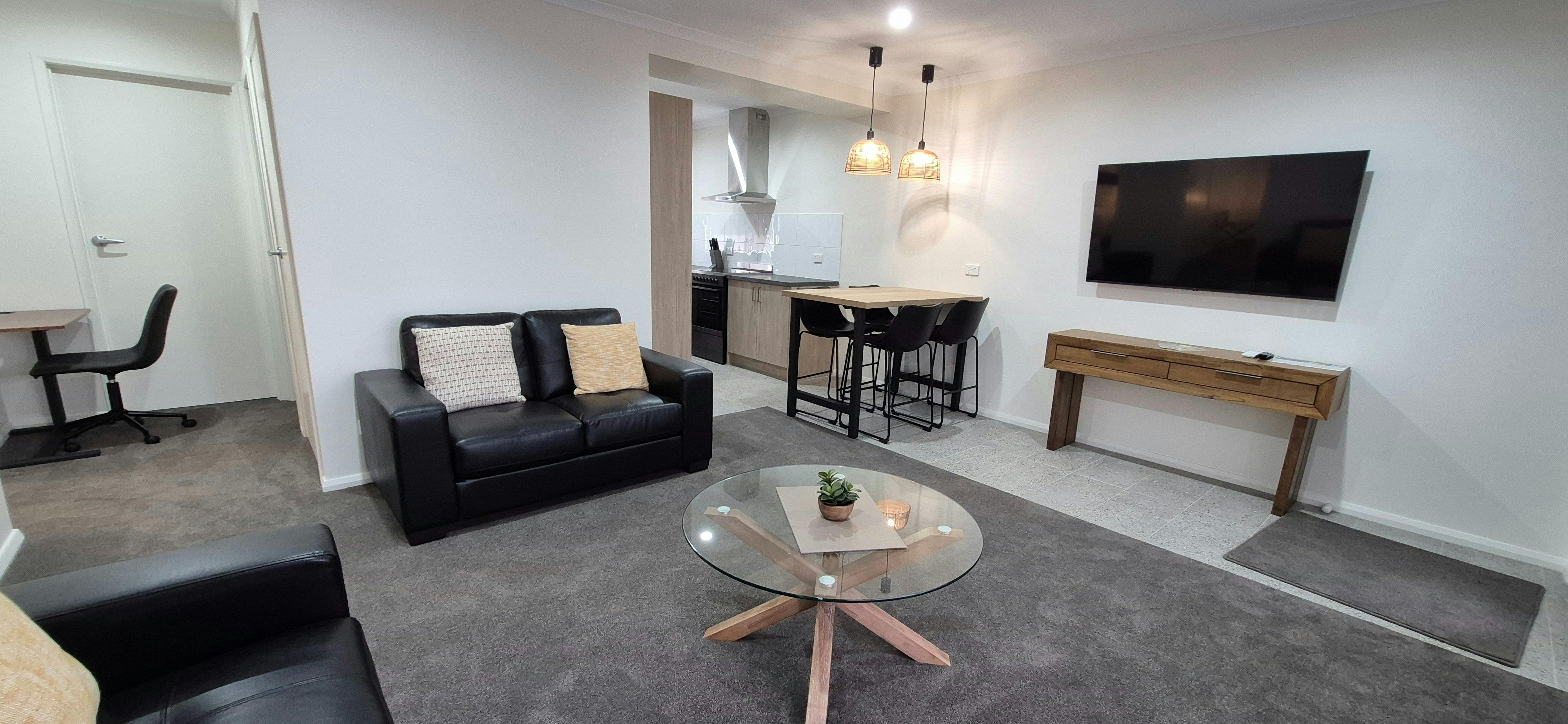 2 x 2 seater lounge, smart tv, breakfast table, split system air conditioner