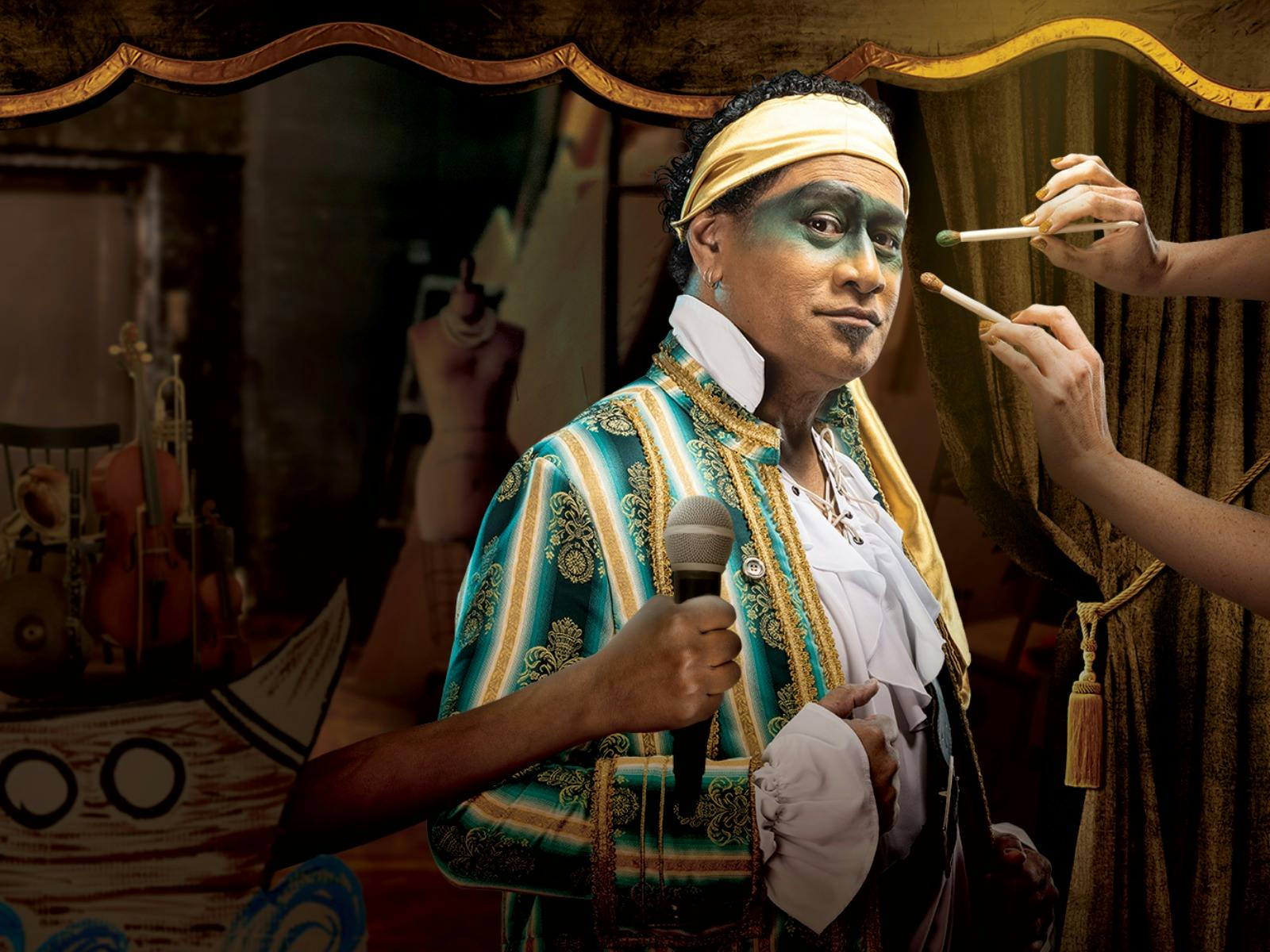 A person in theatrical makeup and costume holds a microphone backstage.