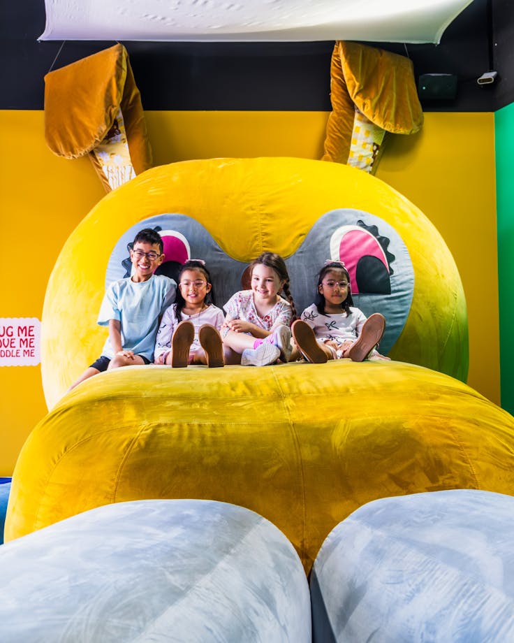 Four children relaxing on Bunny Dearest