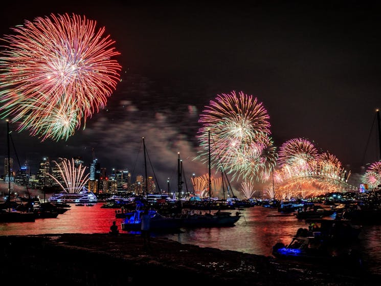 New Years Eve fireworks over Sydney Harbour Bridge as seen from Bradleys Head Amphitheatre