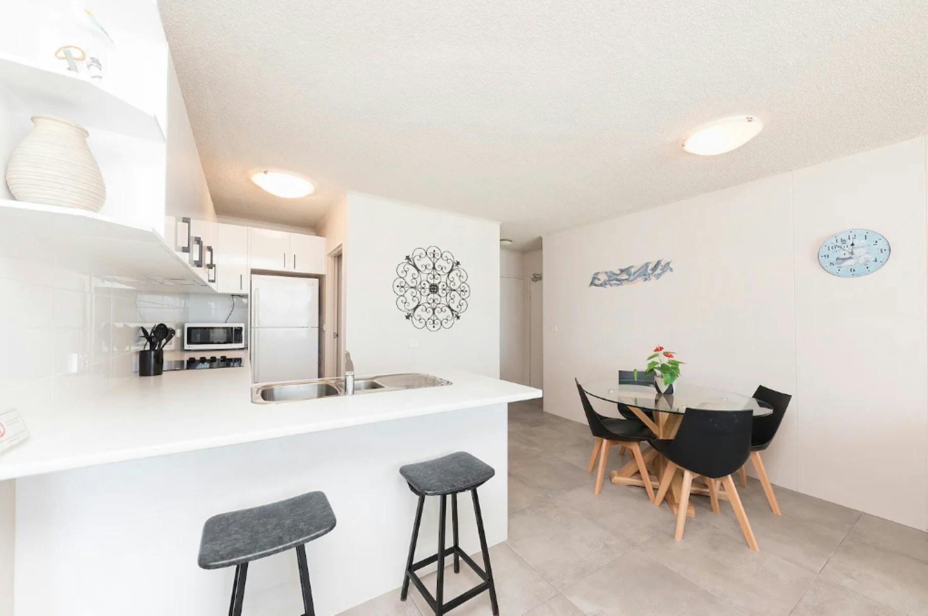 Modern kitchen and dining with 4 seater setting