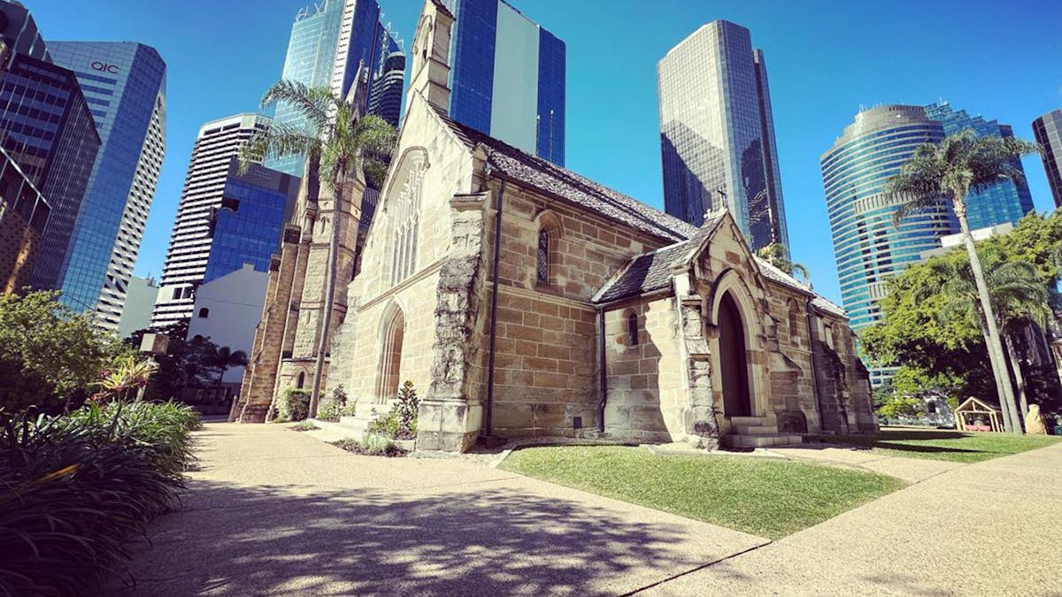 St Stephens cathedral with high rises and blue sky in the back ground